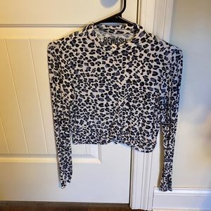 Super fun blue and white cheetah shirt with a mock high neck!